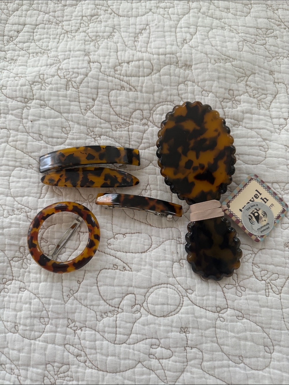 Anthropologie travel size brush, Hair Clip Set and Peepers blue-light glasses